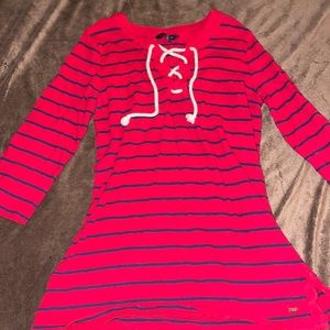 Red and navy blue striped Tommy Hilfiger shirt .